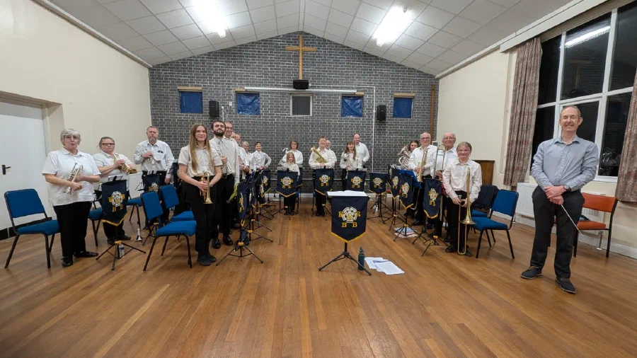 Community brass musicians gathered with their instruments